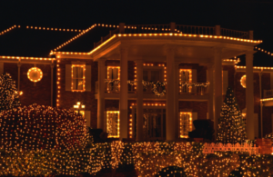 A house warmly lit with Christmas lights